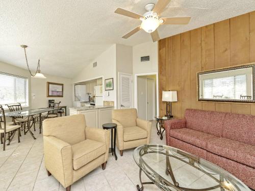 a living room with a couch and chairs and a table at Lake Travis Bungalow Casita Golden Rod #2 in Lakeway