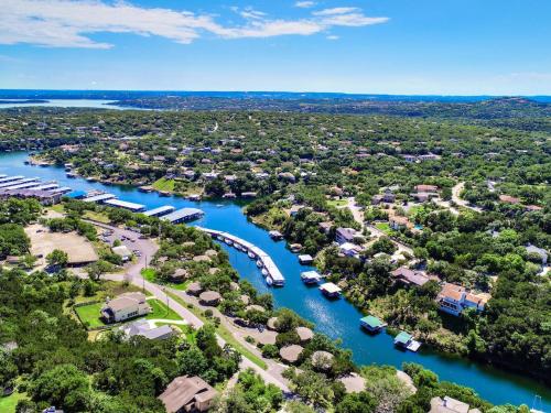 an aerial view of a town with a river and boats at Lakefront Bungalow - Community Poolhot Tub #11 in Lakeway