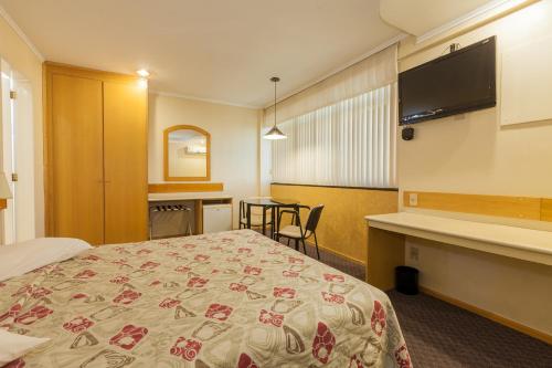 Tri Hotel Smart Caxiasにあるベッド