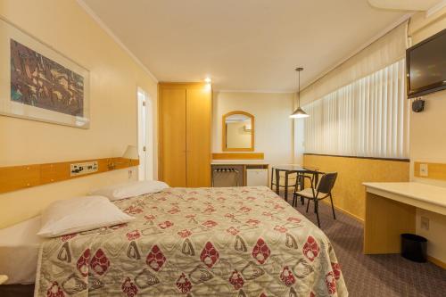 Tri Hotel Smart Caxiasにあるベッド