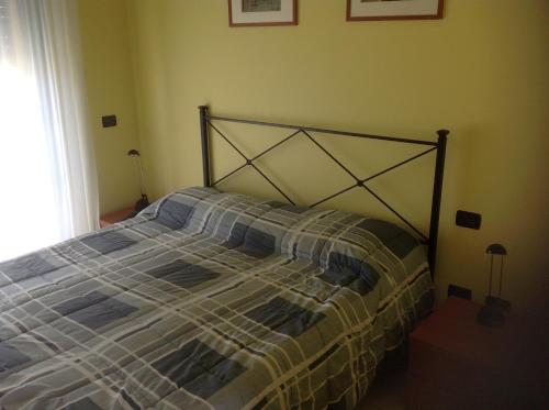 Un pat sau paturi într-o cameră la Le Torri