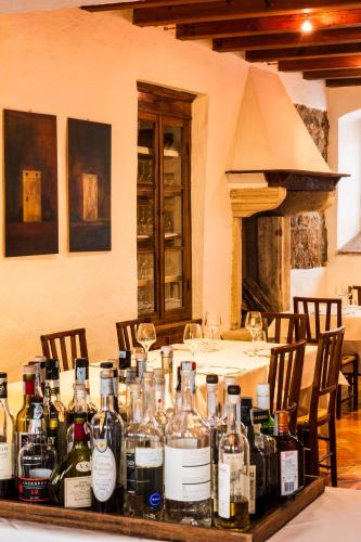 a table with many bottles of alcohol on it at Villa de Winckels in Tregnago