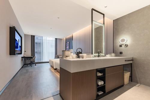 Μια τηλεόραση ή/και κέντρο ψυχαγωγίας στο Atour Hotel Shanghai Daning International Circus City