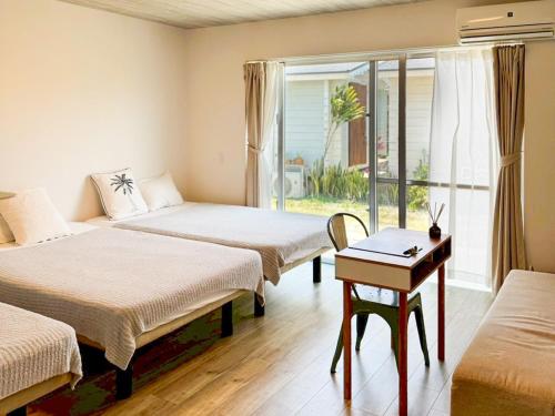 Ένα ή περισσότερα κρεβάτια σε δωμάτιο στο GuesthouseKAZE