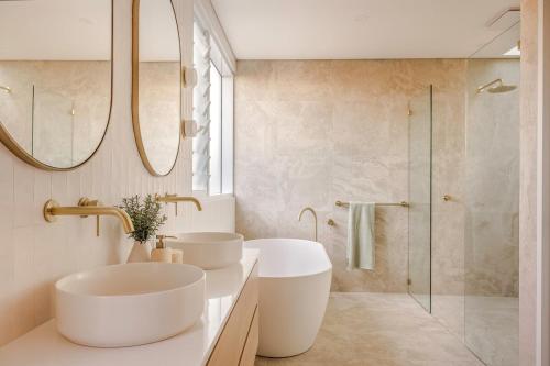 a bathroom with two sinks and a shower at New- Amara Sands - Dunsborough - Heated Pool in Dunsborough
