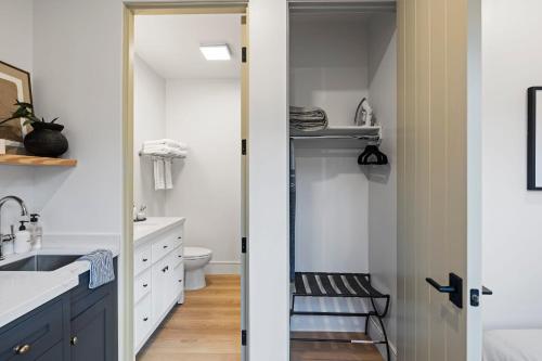 a bathroom with a sink and a toilet at Casa Jardin - Boutique Suites in Downtown Santa Barbara in Santa Barbara