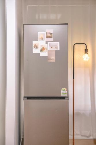 a stainless steel refrigerator with pictures on it at Sillim Queen House in Seoul