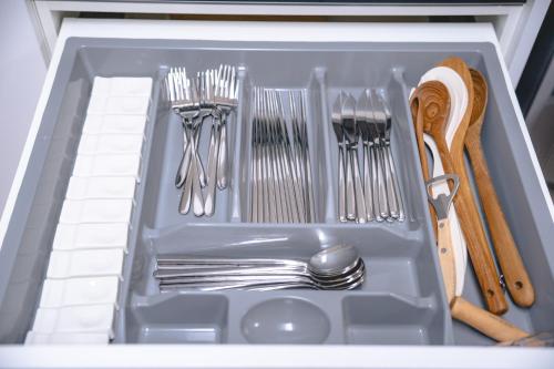 a drawer filled with utensils in a refrigerator at Sillim Queen House in Seoul