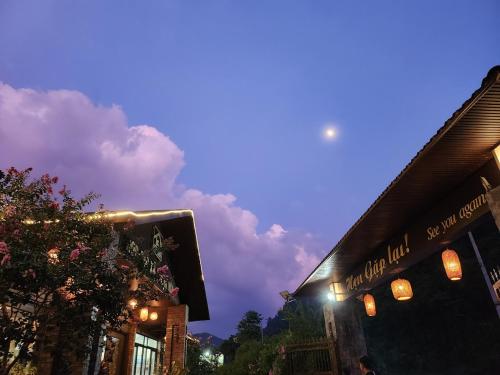 a building with a sign on the side of it at night at Jasmine Retreat 