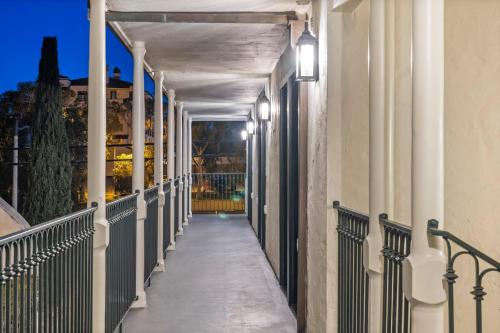 a hallway of a building with lights on it at Casa Jardin - Boutique Suites in Downtown Santa Barbara in Santa Barbara