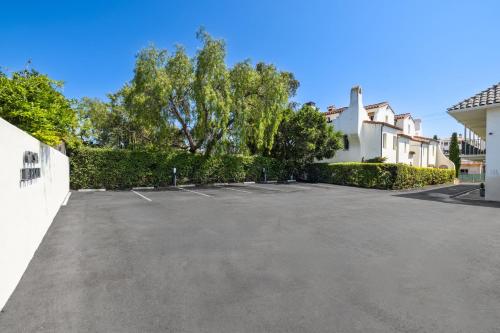 a parking lot in front of a building at Casa Jardin - Boutique Suites in Downtown Santa Barbara in Santa Barbara