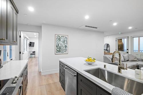 a kitchen with a sink and a counter top at Casa Jardin - Boutique Suites in Downtown Santa Barbara in Santa Barbara