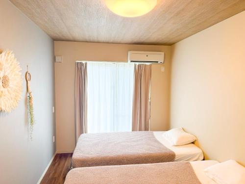 Ένα ή περισσότερα κρεβάτια σε δωμάτιο στο GuesthouseKAZE