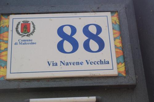 a sign on the side of a building at "CASABANA" - relax tutto l'anno - giardino - piscina Top in Malcesine