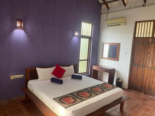 a bedroom with a large bed in a room at Vanaro Resort in Yala