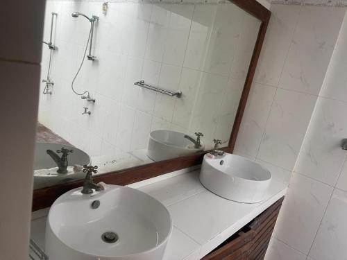 a bathroom with a sink and a mirror at Vanaro Resort in Yala