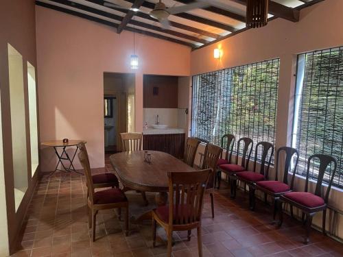 a dining room with a table and chairs at Vanaro Resort in Yala
