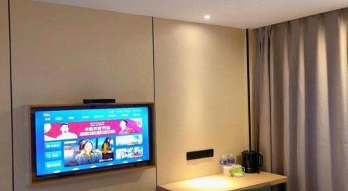 Televisyen dan/atau pusat hiburan di GreenTree Inn Yangzhou Slender West Lake Wencheng Attic Express Hotel