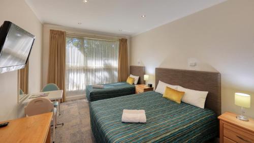 Ένα ή περισσότερα κρεβάτια σε δωμάτιο στο Quality Inn Swan Hill