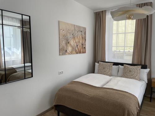 Ένα ή περισσότερα κρεβάτια σε δωμάτιο στο Fewo CityNest Kempten
