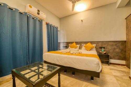 Postel nebo postele na pokoji v ubytování Corbelli Residency