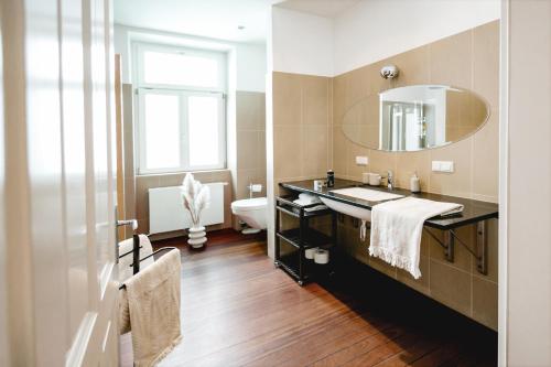 a bathroom with a sink and a mirror at My Wonderland in Salzburg