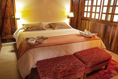 Кровать или кровати в номере The Wooden House Hotel