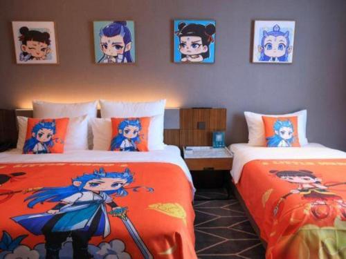 a bedroom with two beds and pictures on the wall at Chongqing The Lotus Hotel in Chongqing