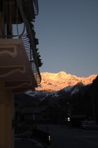 a view of the mountains from a balcony of a building at R.T.A. Hotel Monte Rosa in Champoluc