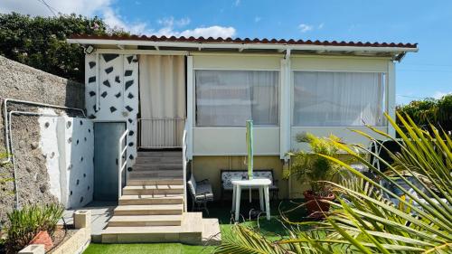 a small house with a table in the yard at Finca Maradentro - private pool and jacuzzi with ocean view in Arafo