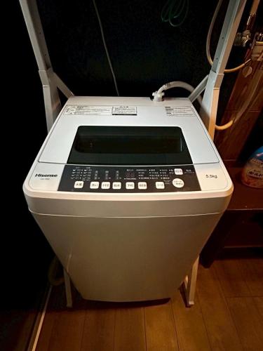 a electronic device sitting on top of a floor at Denim-yado Ken-健- in Tamano