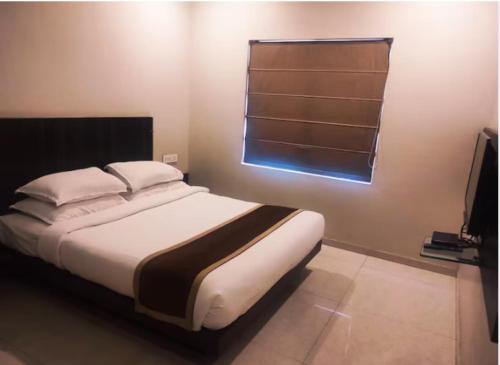 Hotel Rasikaにあるベッド