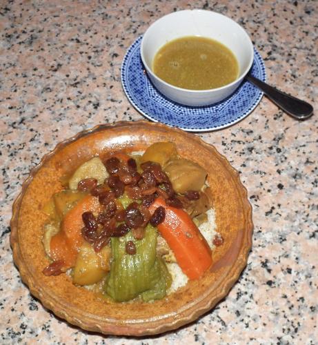 a bowl of food on a table with a bowl of soup at Hotel Tomboctou in Tinerhir