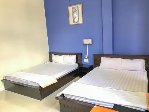 Кровать или кровати в номере Thien Huong Hotel