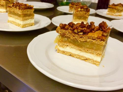 a piece of cake on a white plate on a table at Willa Hamernik AGROTURYSTYKA in Tylicz