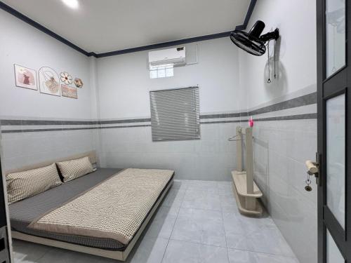 Postel nebo postele na pokoji v ubytování Homestay Xóm Biển Garden