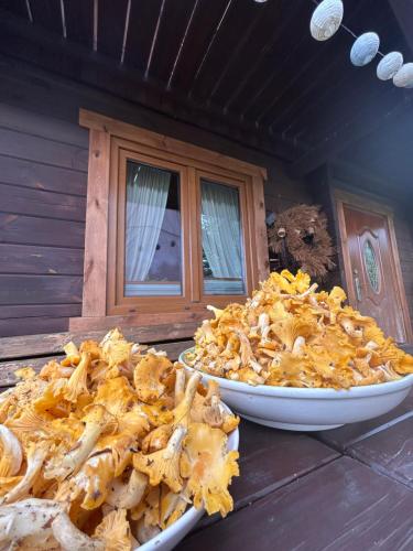 two plates of food sitting on a table next to a window at Monasteria in Stare Monasterzysko