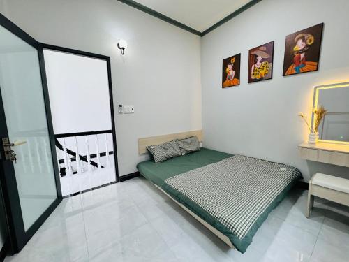 Postel nebo postele na pokoji v ubytování Homestay Xóm Biển Garden