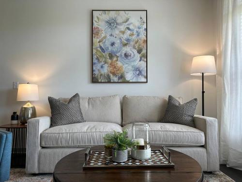 a living room with a couch and a table at Spotless Remote Work Flat Pool Fast Wifi in Dublin