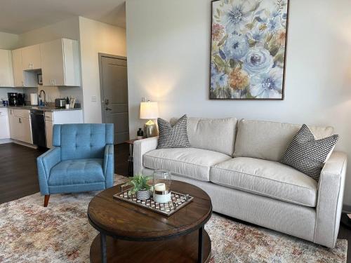 a living room with a couch and a table at Spotless Remote Work Flat Pool Fast Wifi in Dublin