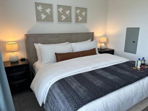 a bedroom with a large bed with two night stands at Spotless Remote Work Flat Pool Fast Wifi in Dublin