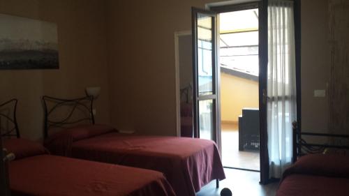 Postel nebo postele na pokoji v ubytování Hotel Ciocca