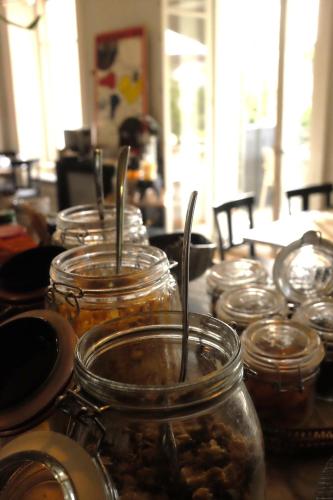 a group of jars of food sitting on a table at La Maison d'Igor in Morges