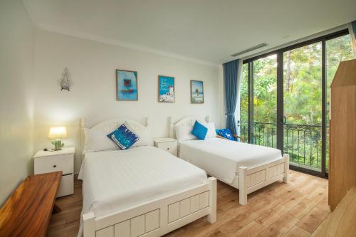 Katil atau katil-katil dalam bilik di Villa Hoa Xương Rồng - Venus resort - Sang trọng giữa thiên nhiên