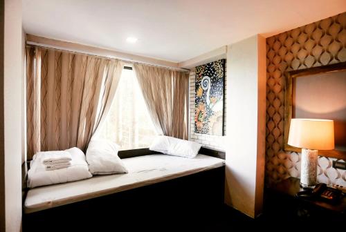 Postel nebo postele na pokoji v ubytování Amega Hotel Tagaytay