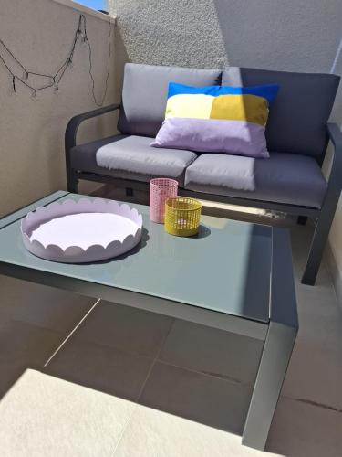 a living room with a couch and a glass table at Graceful LJUPKA GETAWAY by the sea - Lokva Rogoznica, Omiš in Lokva Rogoznica