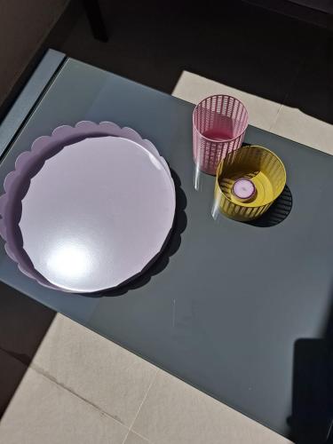 an overhead view of a table with a plate and two baskets at Graceful LJUPKA GETAWAY by the sea - Lokva Rogoznica, Omiš in Lokva Rogoznica