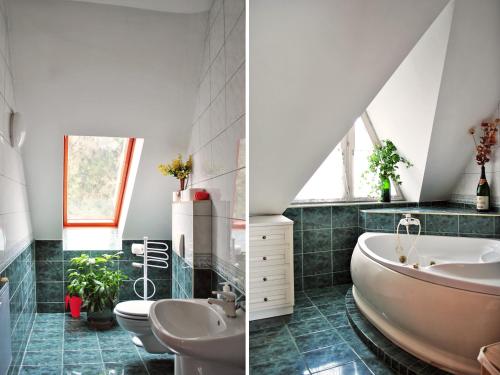 a bathroom with two sinks and a bath tub at Tot&aacute;lis Harm&oacute;nia Villa in Miskolctapolca