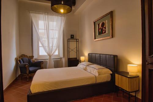 Postel nebo postele na pokoji v ubytování Michelangelo Escape Suite