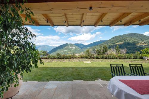 a view from a patio with mountains in the background at Villa Alessandra in Pellio Inferiore
